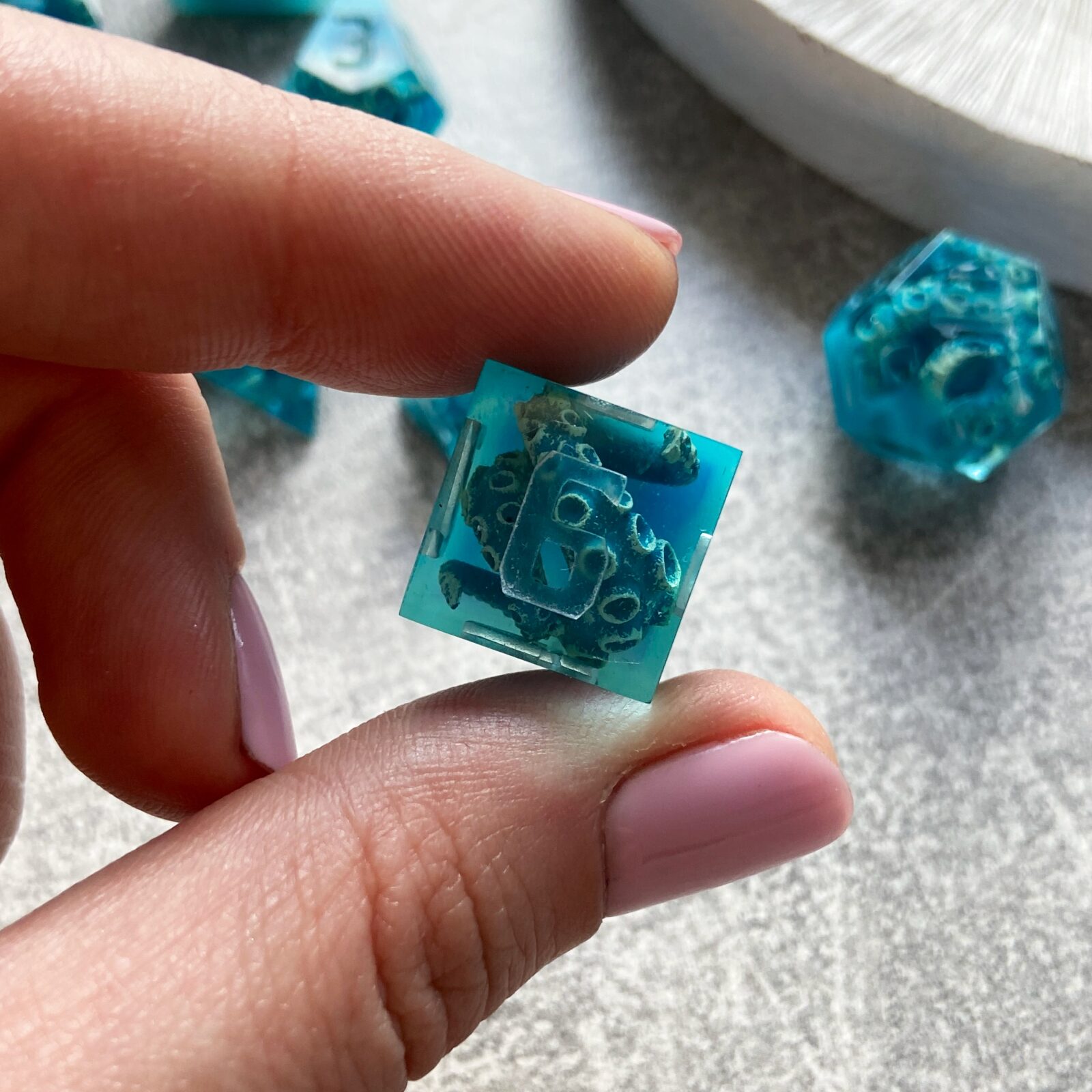 handmade d and d polyhedral dice with octopus